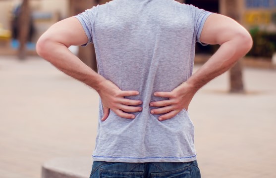 Back pain and stiffness in the lower spine